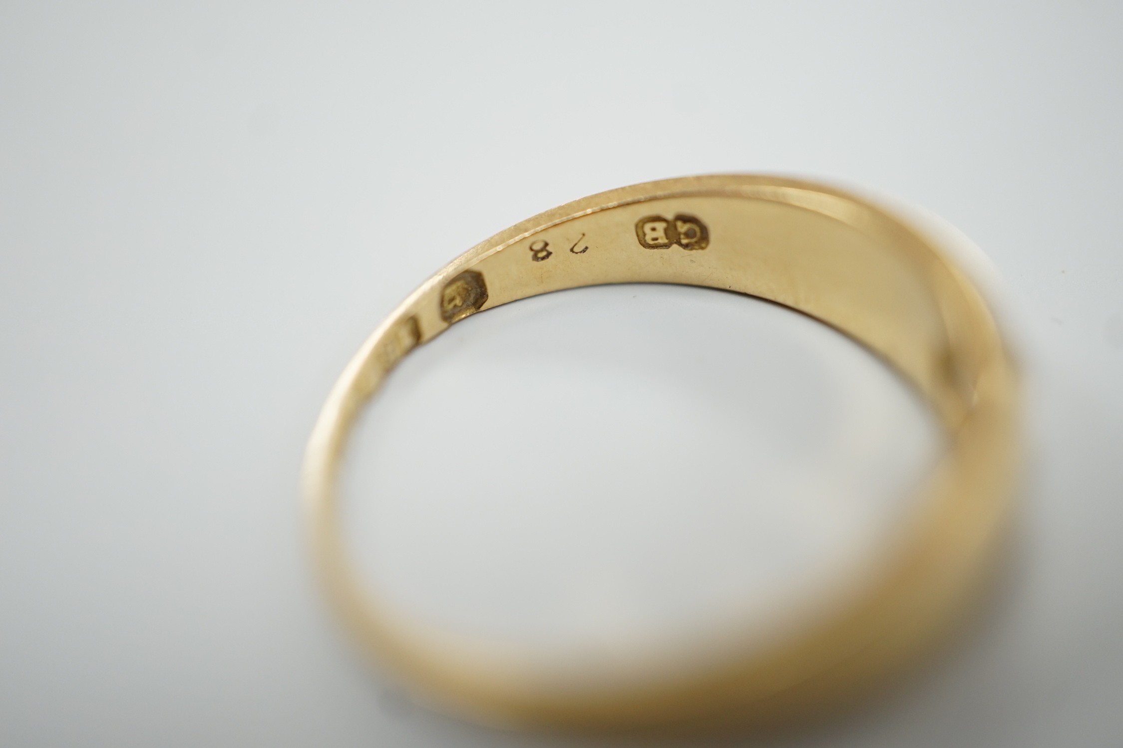 An early 20th century 18ct gold and gypsy set solitaire diamond ring, size M, gross weight 3.2 grams